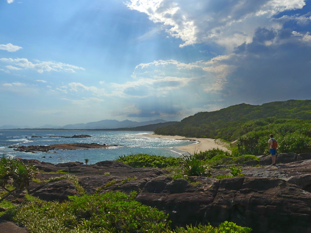 southern sandy beach in Madagascar, rimmed by green forests