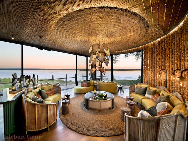 The common sitting area overlooking the river at sunset at Lolebezi Camp in the Lower Zambezi National Park, Zambia